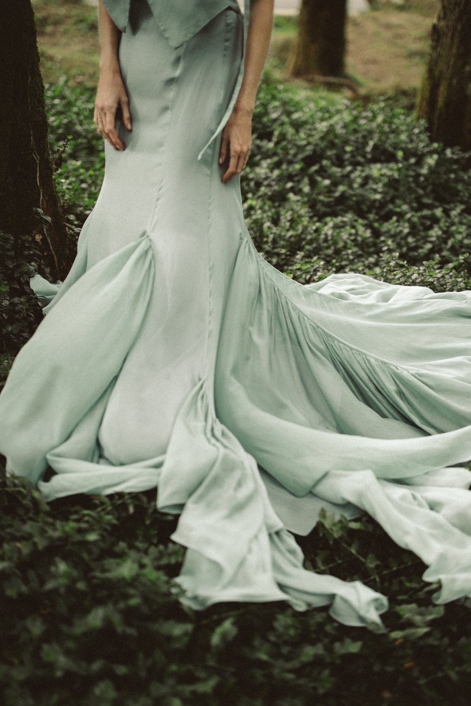 Miryelle ethereal wedding skirt in sage green silk chiffon with mermaid silhouette and flowing train on forest floor — bridal separate by MYWONY
