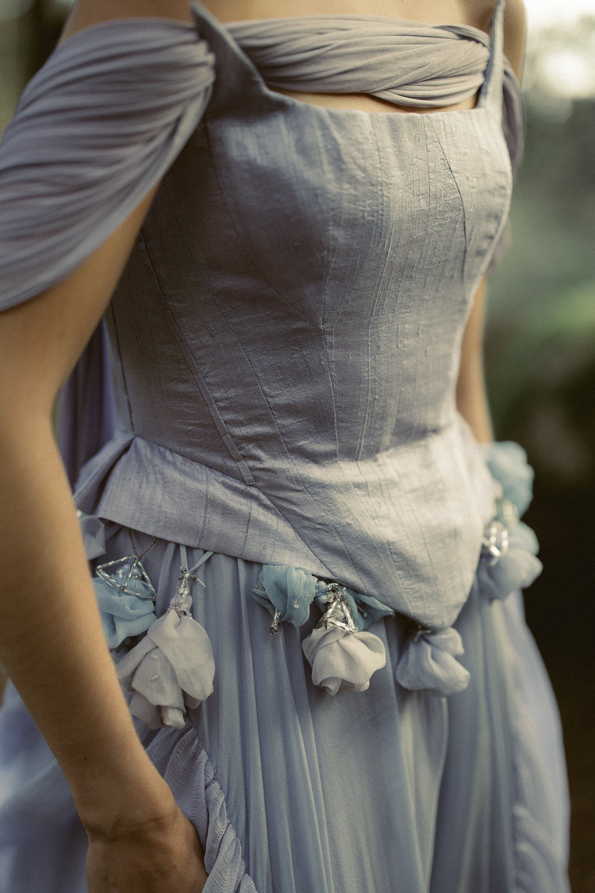 Blooming Belt waist detail with hanging silk organza flowers and beading on a boho blue bridal gown by MYWONY