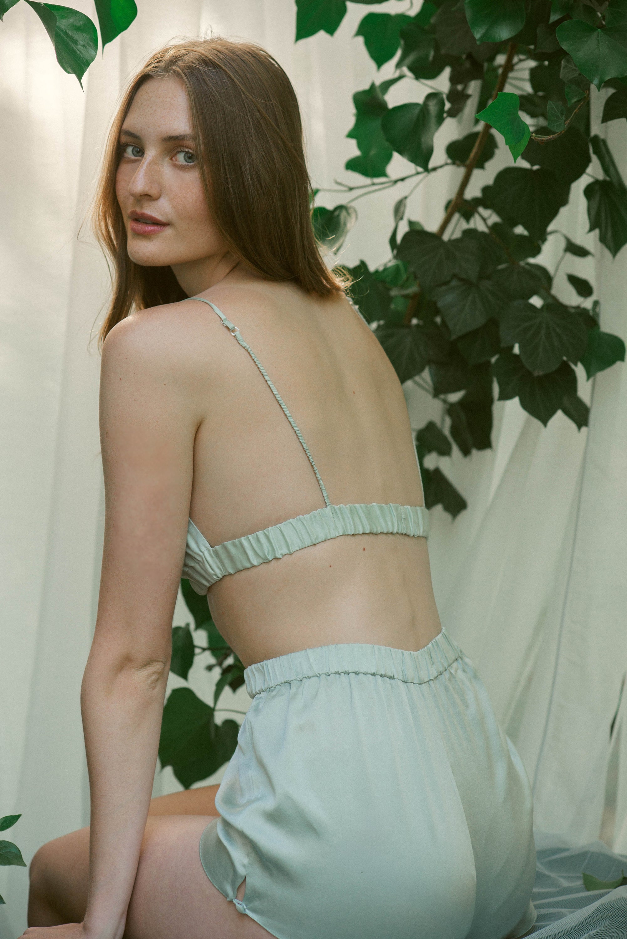 Back view of Mýwony lavender mulberry silk bralette and shorts showing adjustable cross-back straps