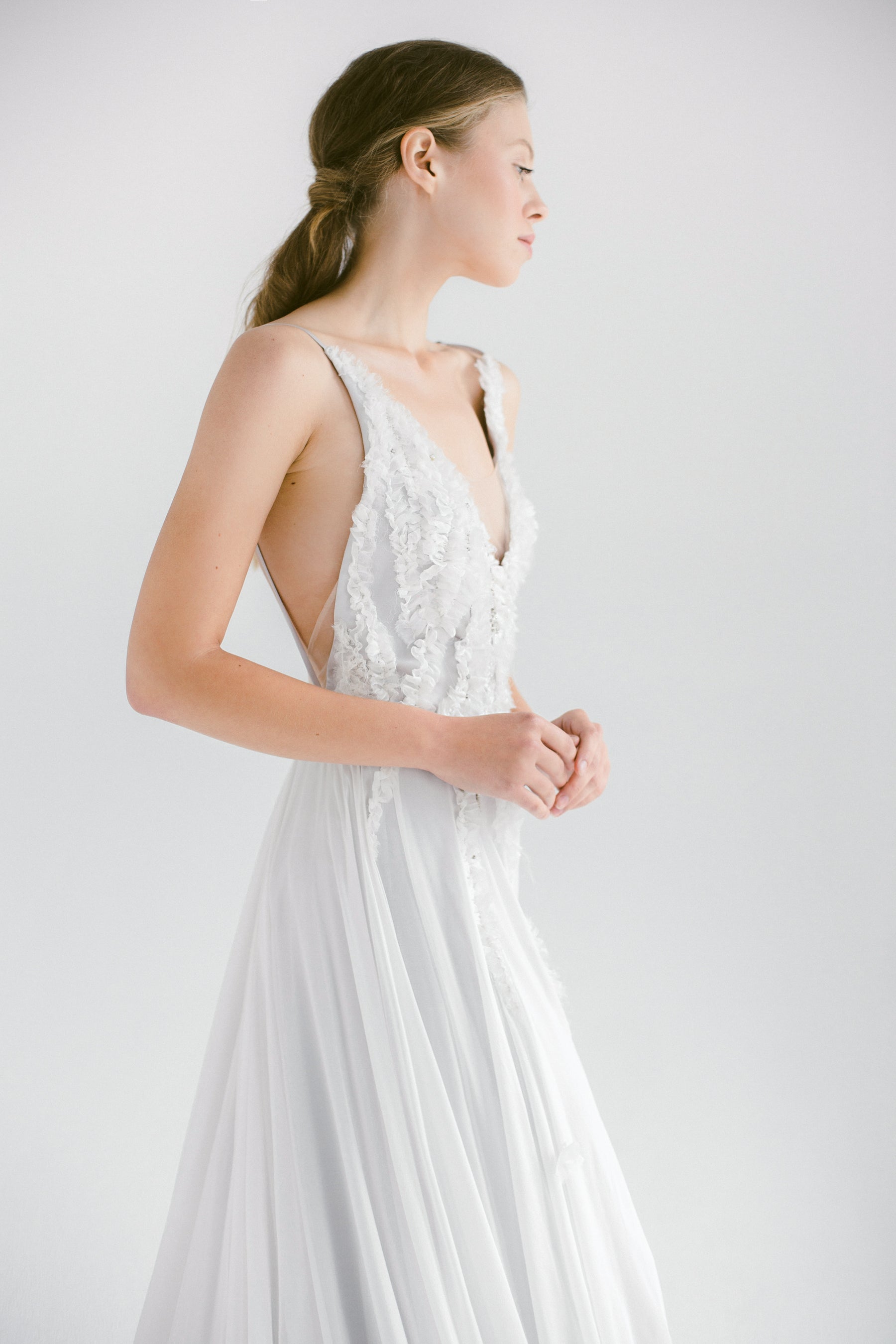 Bohemian Mýwony wedding dresses styled in different venues — garden, beach, and forest settings